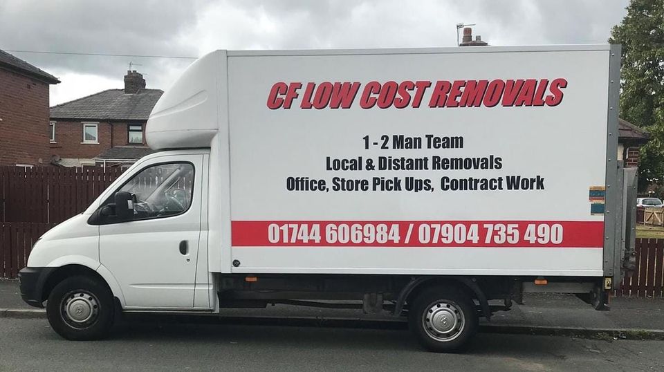 The image shows a white removal van with text advertising a removal service. Here's the text content from the van:

CF LOW COST REMOVALS

1-2 Man Team
Local & Distant Removals
Office, Store Pick Ups, Contract Work

01744 606984 / 07904 735 490

This van appears to be parked on a residential street, with houses visible in the background. The company offers various removal services, including local and long-distance moves, as well as commercial services for offices and stores. They provide a small team of 1-2 people for their removals. Two contact numbers are provided for potential customers to reach out to the company.